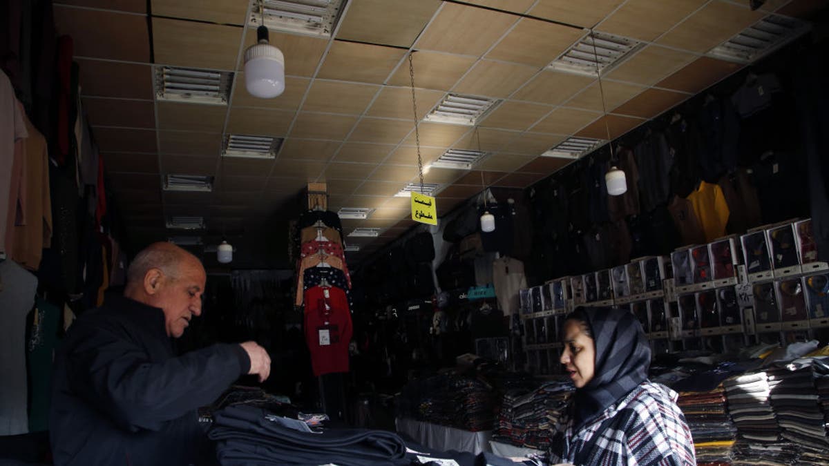 TEHRAN, IRAN - DECEMBER 19: A view of the shops as power cuts are occurring across the country, including in the capital, Tehran, Iran on December 19, 2024. In Iran, where electricity supply issues are prevalent, power outages that are typically experienced during the summer have extended into the winter this year. Due to the outages, schools and public institutions have been closed in many cities, while in some areas, education will continue online.