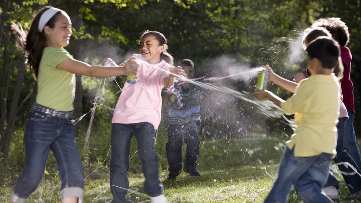 Kids playing with silly string