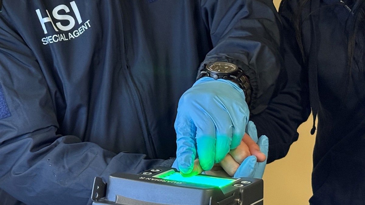 ICE officers get fingerprints on one of the known or suspected associates of the Venezuelan Tren da Aragua gang after a successful joint operation to dismantle an illegal commercial sex and sex trafficking enterprise out of Nashville motels from July 2022 through March 2024.