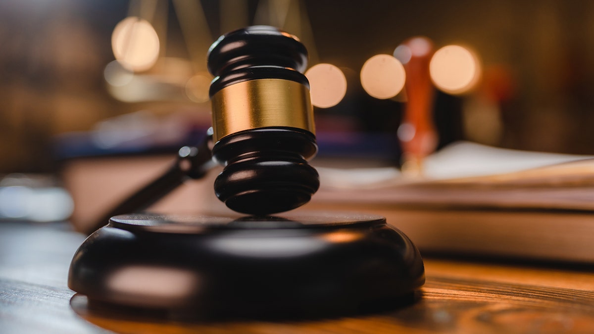 gavel on block on a desk stock image