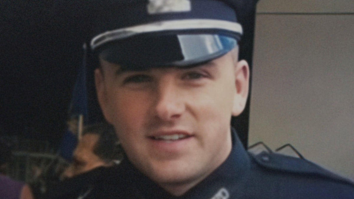 A close-up of John O'Keefe in a police uniform.