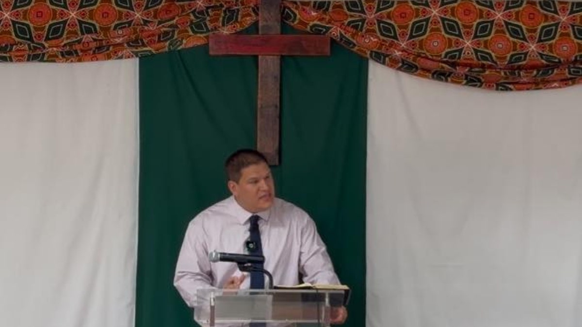 Josh Sullivan preaches at an altar in South Africa