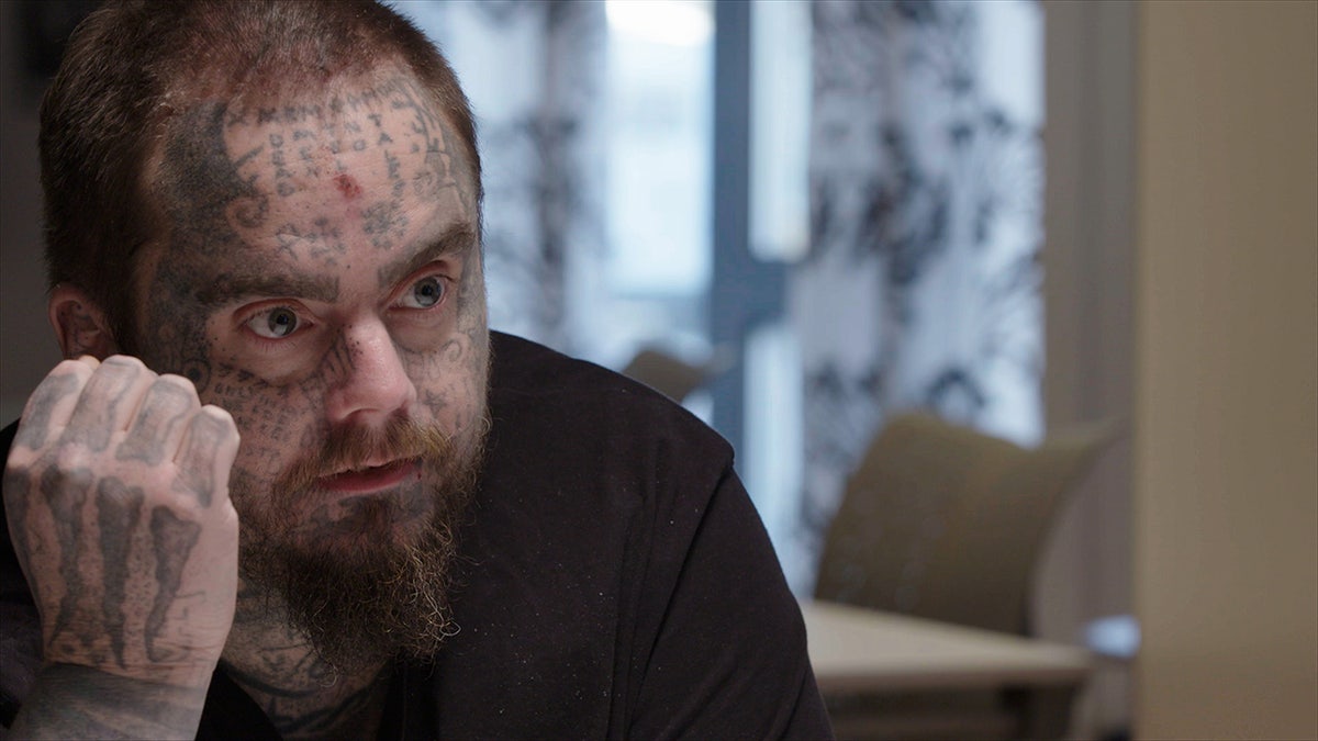 A close-up of Isakin Jonsson wearing a black shirt.