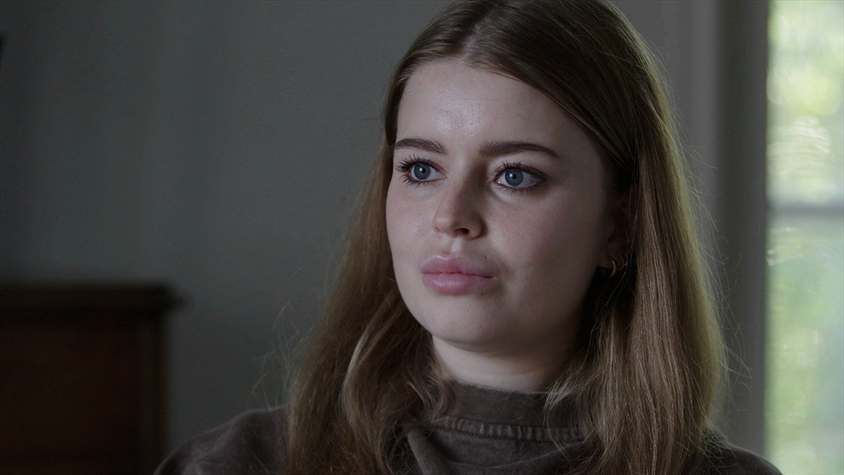 A close-up of Jamie-Lee Arrow wearing a brown sweater.