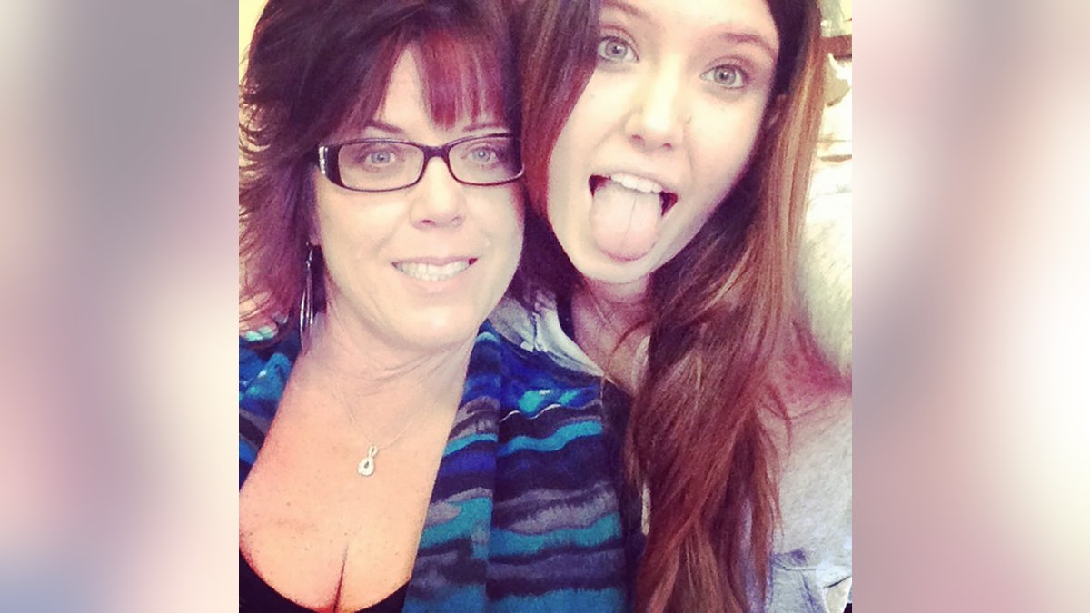 Jane Parrent posing with her daughter Baylee Despot who is sticking out her tongue.