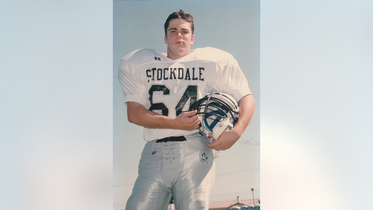 A young Micah Holsenbake in a football uniform.