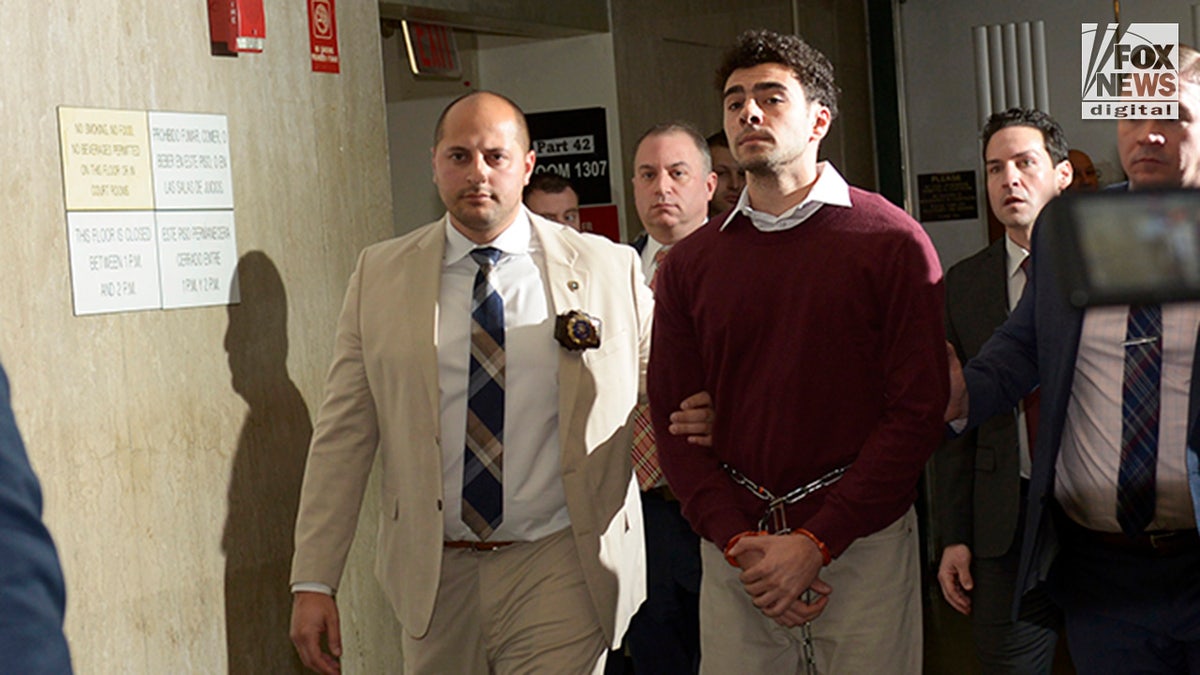 Luigi Mangione departs the courtroom following his arraignment