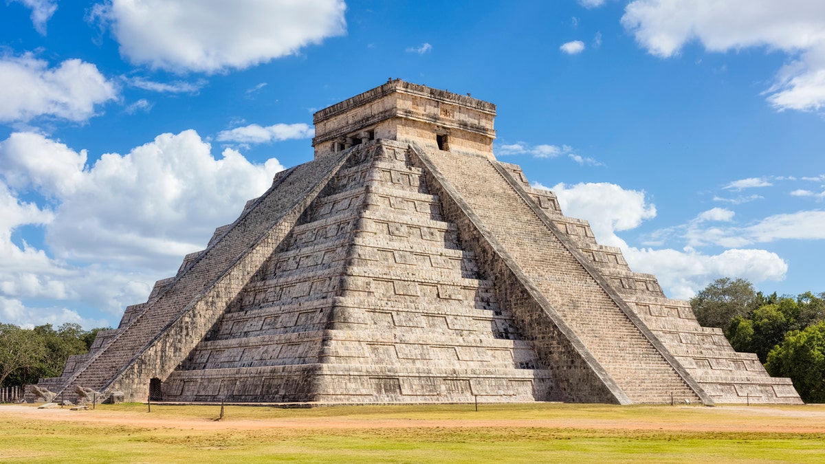 North-west view of the El Castillo (Temple of Kukulkan). El Castillo, also known as the Temple of Kukulcan, is a Mesoamerican step-pyramid that dominates the center of the Chichen Itza archaeological site in the Mexican state of Yucatán. Chichen Itza was a large pre-Columbian city built by the Maya people of the Terminal Classic period. The archaeological site is located in Tinúm Municipality, Yucatán State, Mexico.