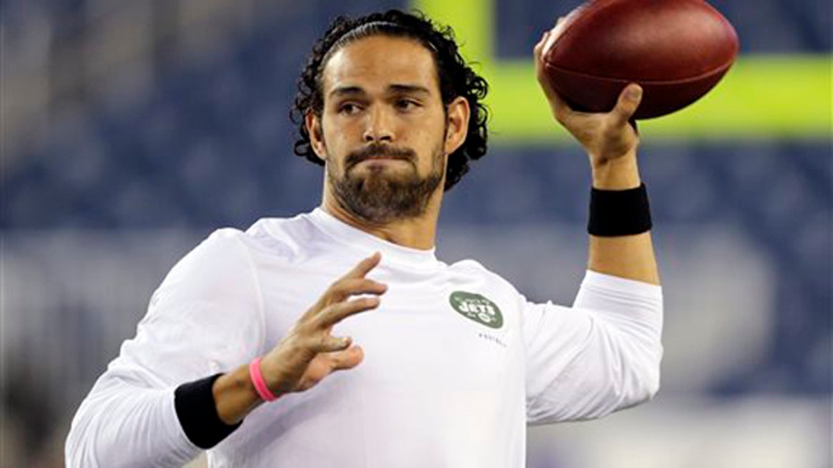 Mark Sanchez warms up