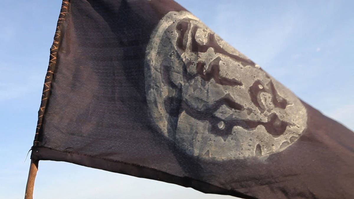 A Boko Haram flag flutters from an abandoned command post in Gamboru deserted after Chadian troops chased jihadists from the border town on February 4, 2015.