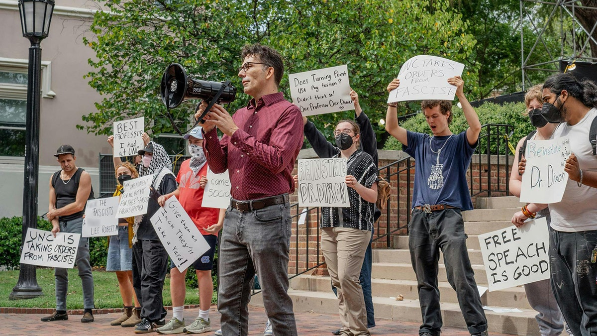 UNC professor Dwayne Dixon supporters rally on campus