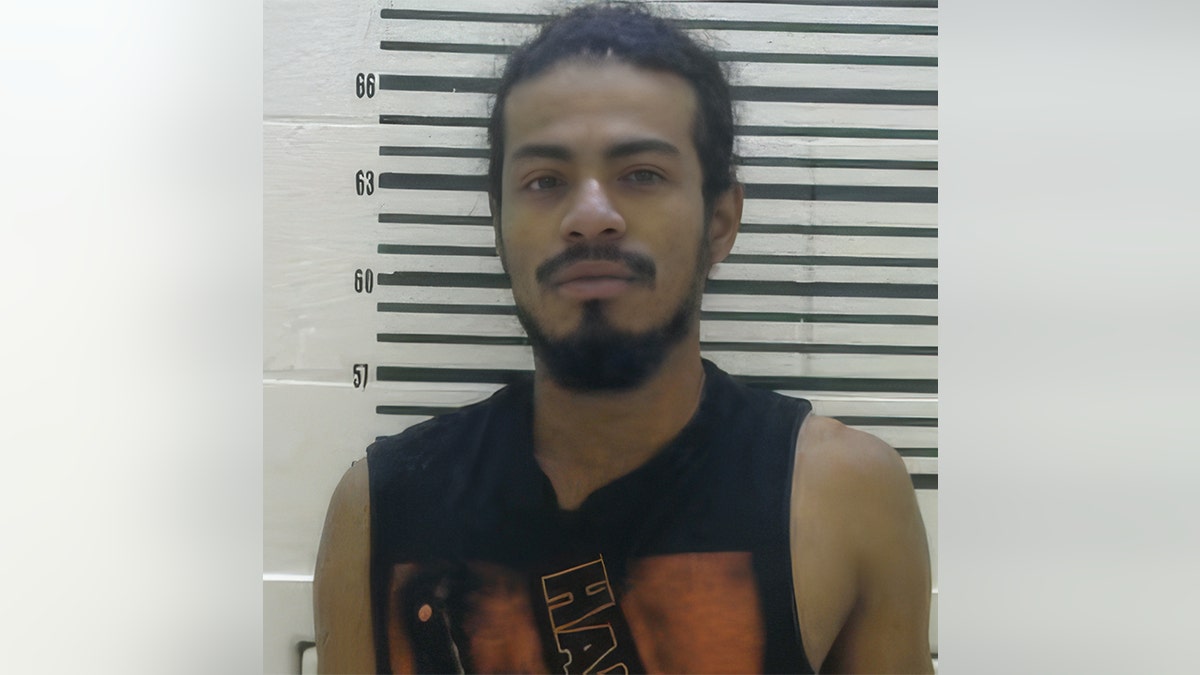 Edwin Pacheco-Meza poses for a booking picture.