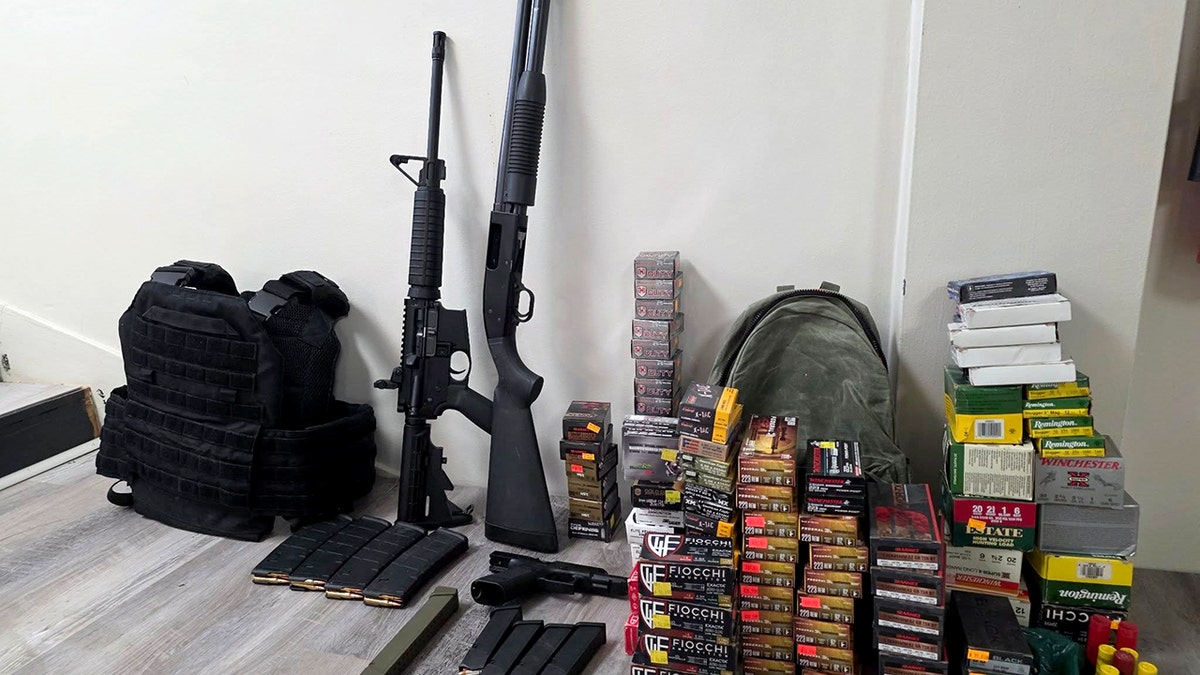weapons and ammo stockpile, including rifles, body armor and dozens of boxes of ammunition