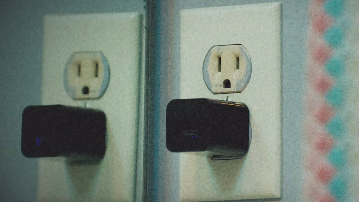 A close-up of a camera appearing to be a plugged phone charger.