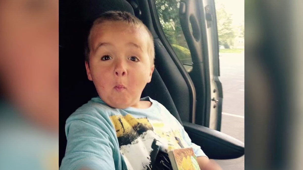 six-year-old boy logan tipton sitting in a carseat