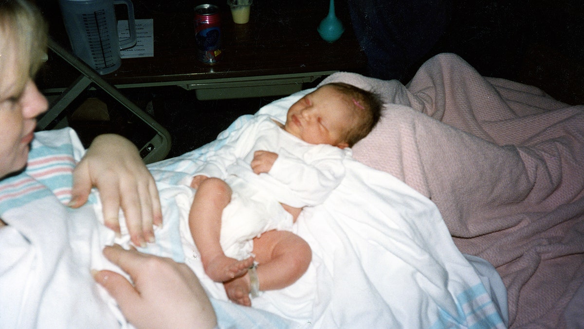 Rebecca Lafferty seen here with her baby daughter after giving birth.