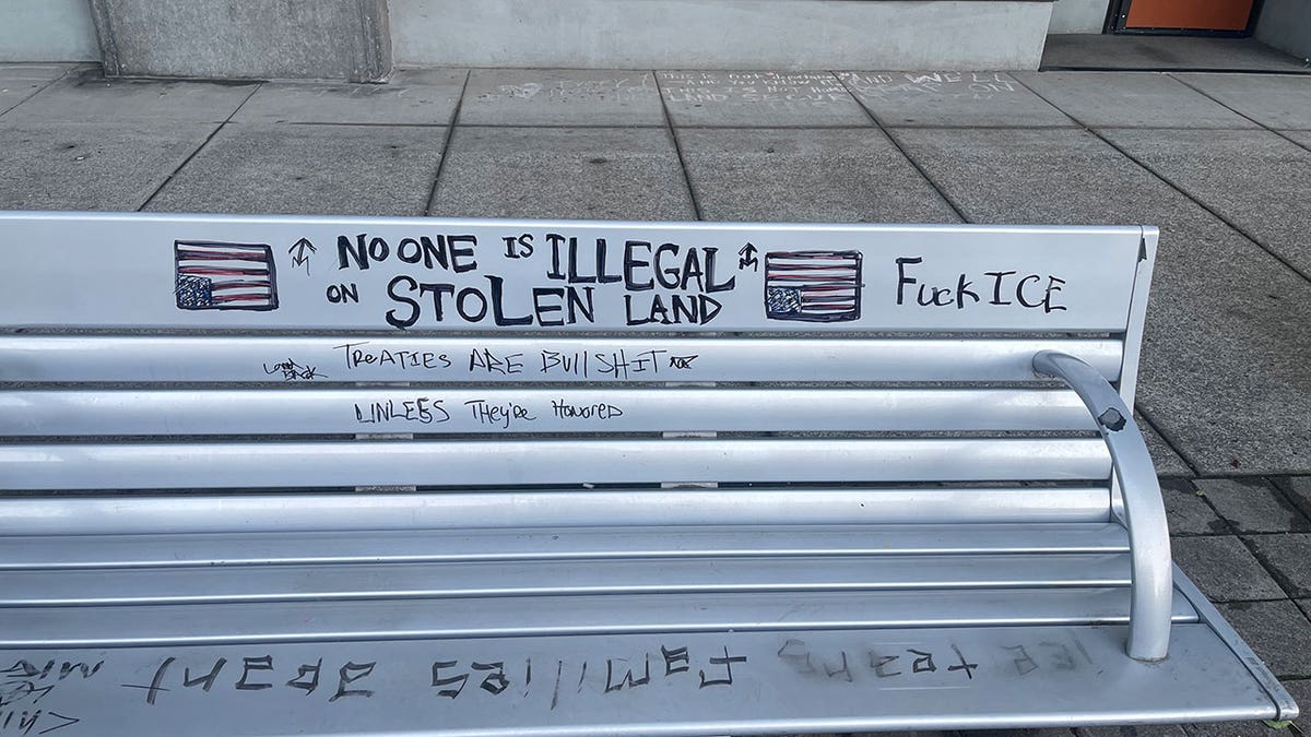 Anti-American graffiti on bench in Portland, Oregon.