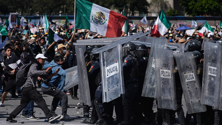 Protesters attack police, breach barrier at Mexico’s National Palace during rally against cartel violence