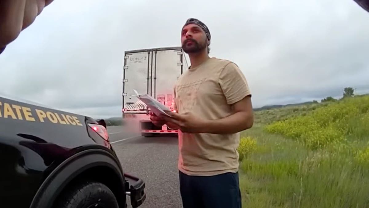 Harjinder Singh holds documents while stopped by New Mexico State Police on July 3, 2025.