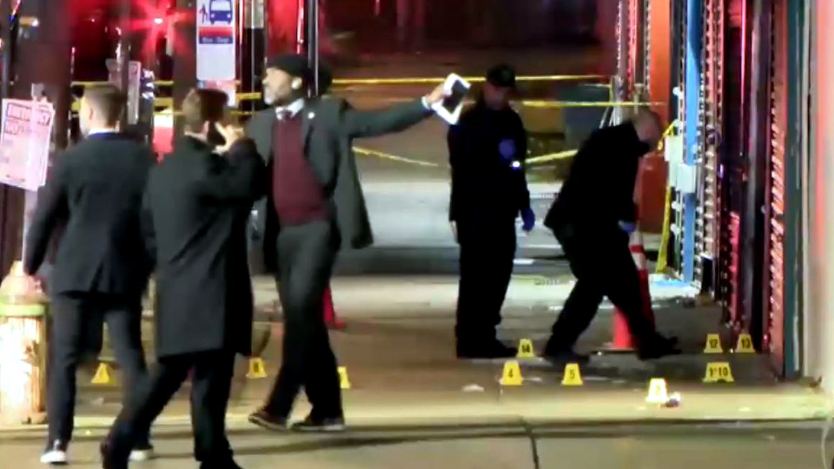 police and detectives investigating the scene