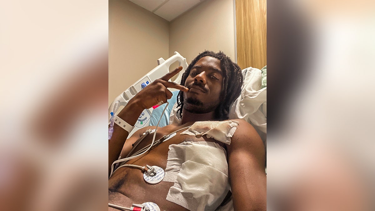 Kenyon Dobie shared photos of himself recovering in the hospital after allegedly being stabbed Friday by an illegal immigrant on the Charlotte Blue Line train.