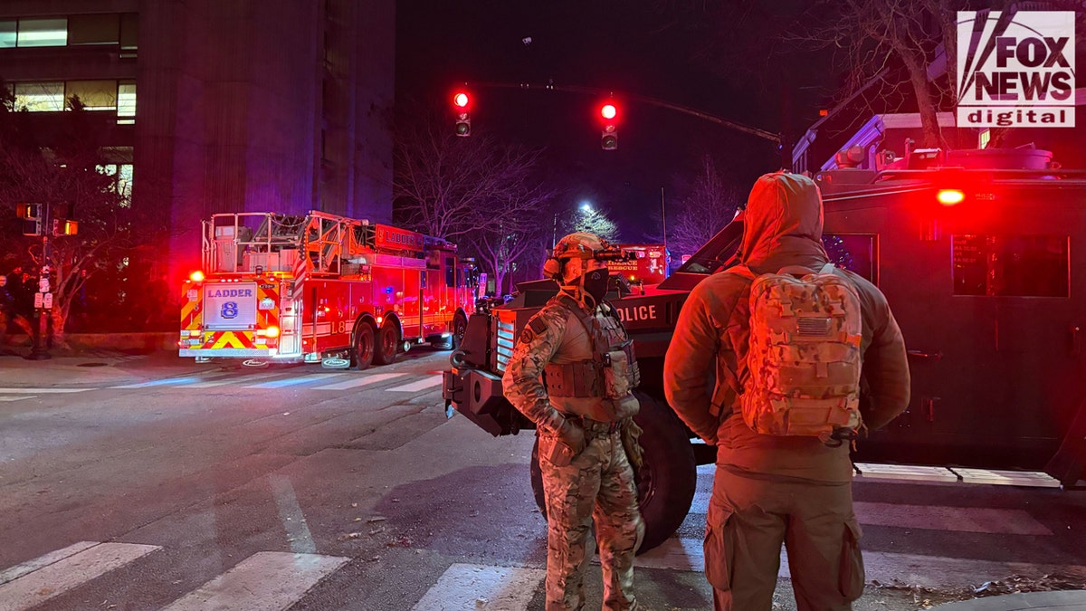 Law enforcement near an armored state police vehicle at Brown University, following a shooting incident on campus on Saturday, Dec. 13, 2025.