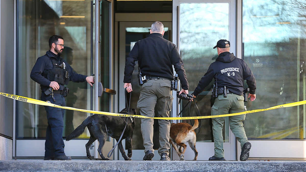 Law enforcement enters door of Brown University shooting scene building