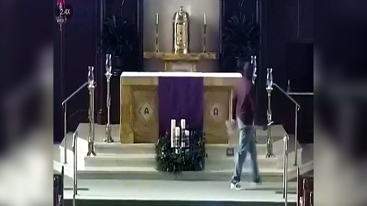 Suspect walking inside the worship area of a church.