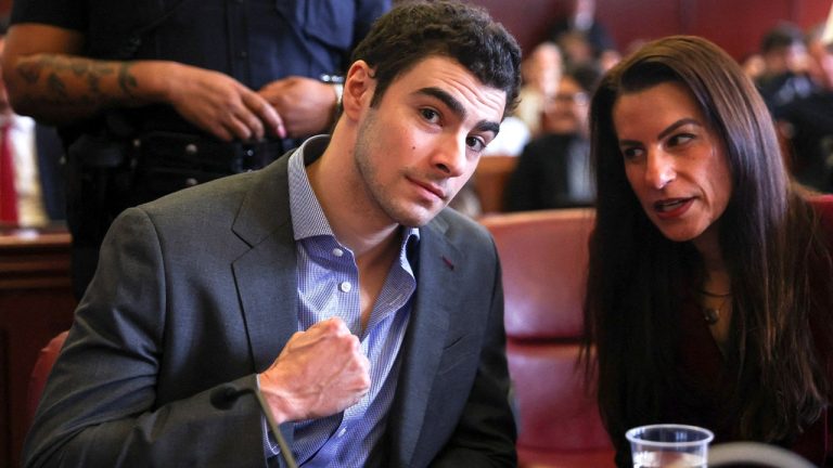 Luigi Mangione pumps fist in court as body cam allegedly reveals loaded magazine found inside wet underwear