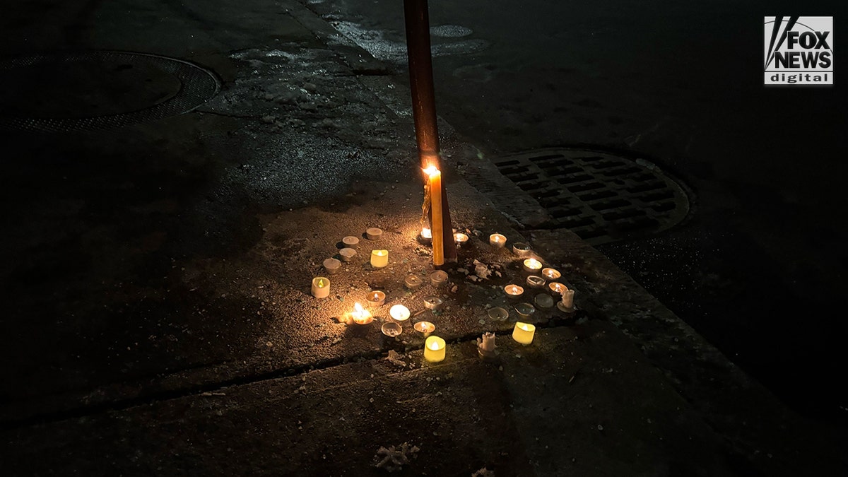 Candles left in memory of MIT professor Numo Louriero