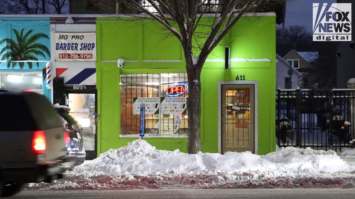 Bright green money-transfer storefront with an