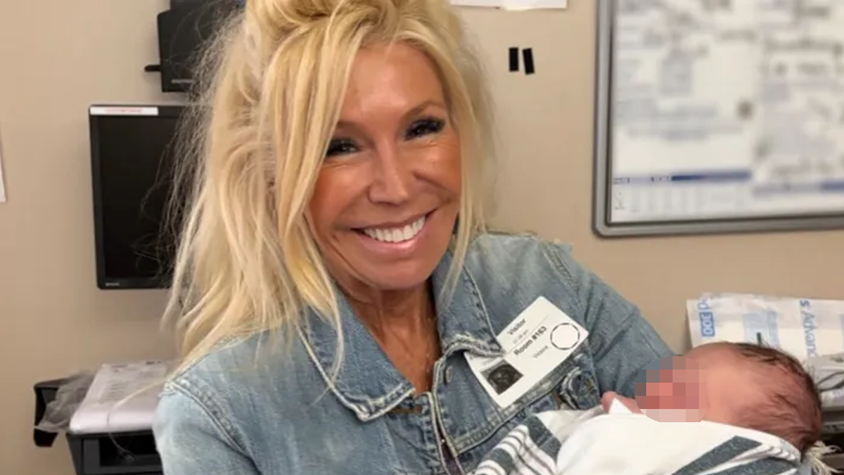 Vicki Cordes holding a baby