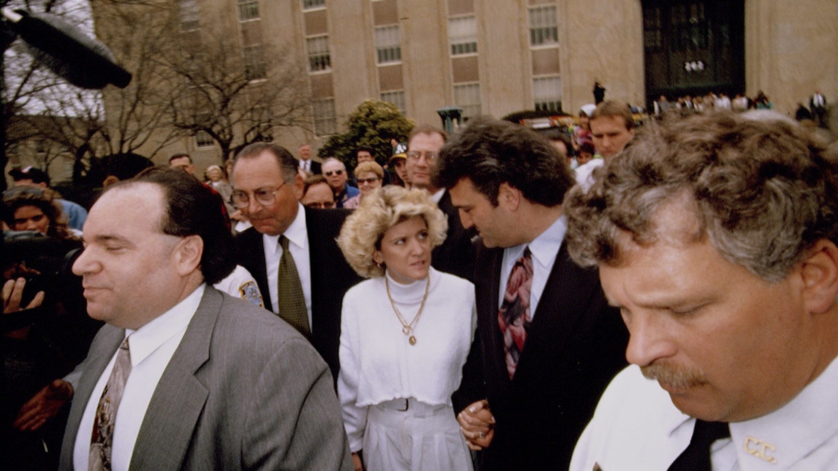 Mary Jo Buttafuoco walking outside a court house with her husband Joey Buttafuoco.