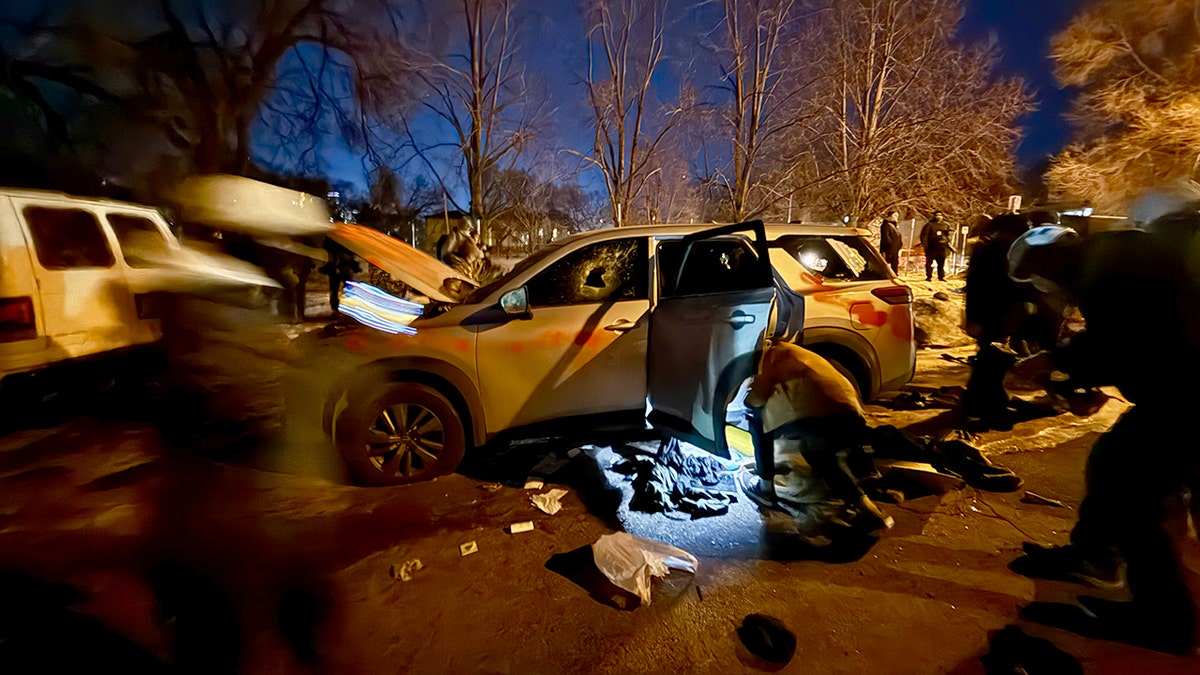 A vehicle is shown vandalized with spray-painted graffiti during unrest in Minneapolis.
