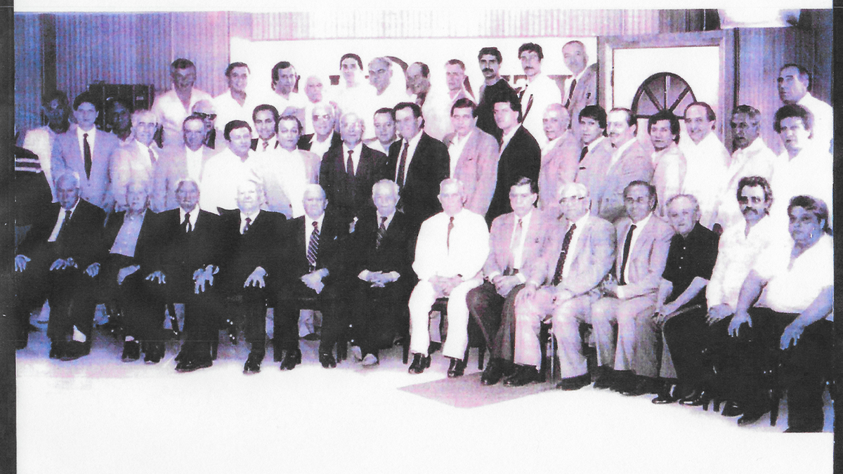 Members and associates of the DeCavalcante crime family pose during a large gathering in New Jersey.