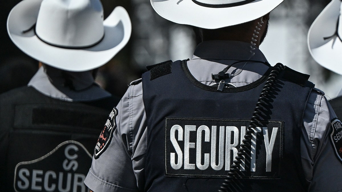security staff wearing cowboy hats