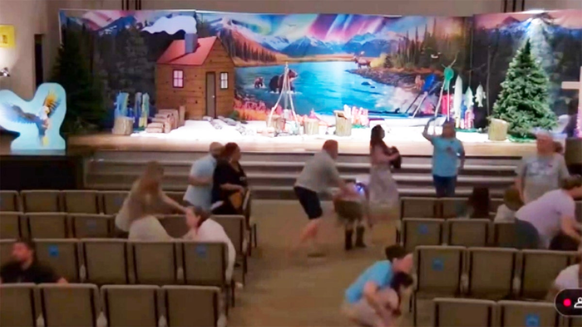 Churchgoers at Crosspointe Church run after gunshots are heard