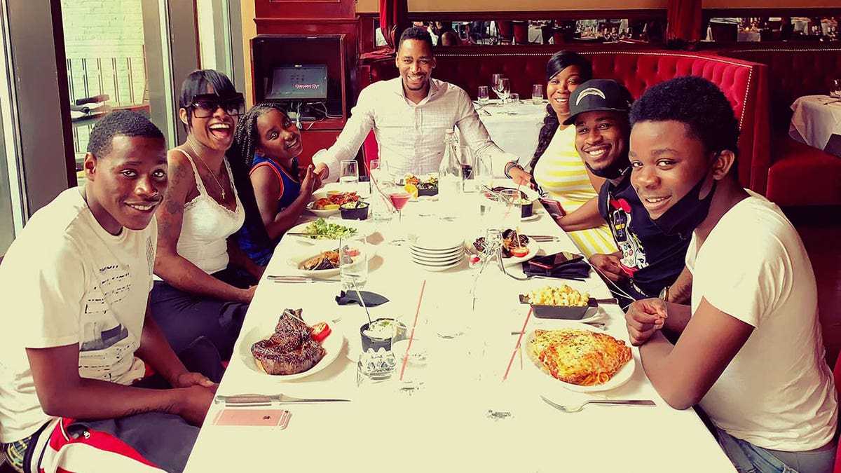 Gianno Caldwell at an early dinner celebrating his little brother Christian's high school graduation.