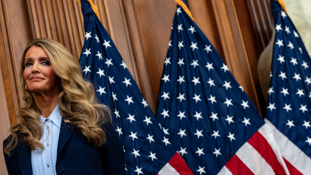 SBA chief Kelly Loeffler listens during. a news conferences in Washington, DC