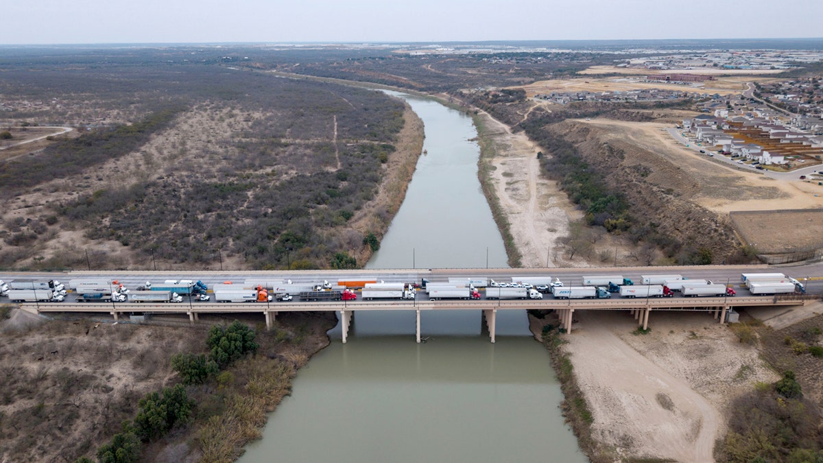 Trucks in line to enter the United States at the World Trade Bridge port of entry on the US-Mexico border in Laredo, Texas,